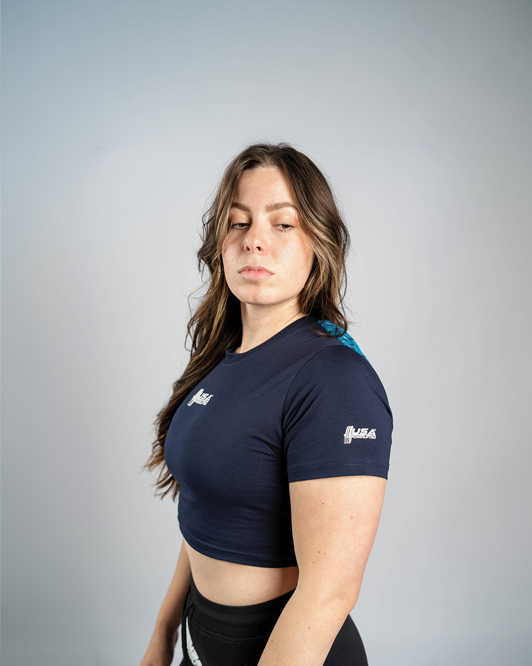 Top técnico para squat o press con grip que evita deslizamientos durante el entrenamiento