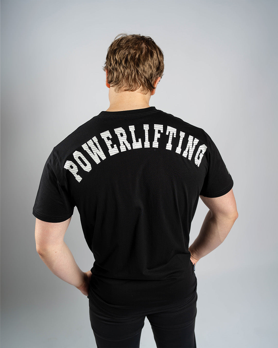 Playera con diseño de powerlifting en la espalda