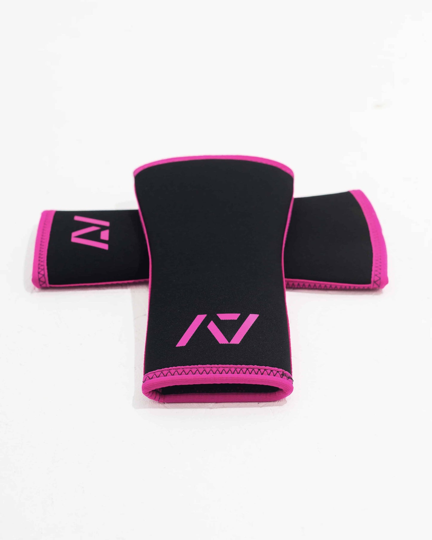 Rodilleras negras con rosa para entrenamiento de powerlifting